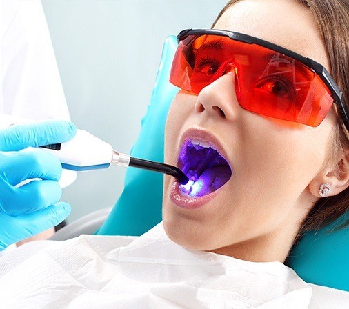 Patient receiving dental sealants